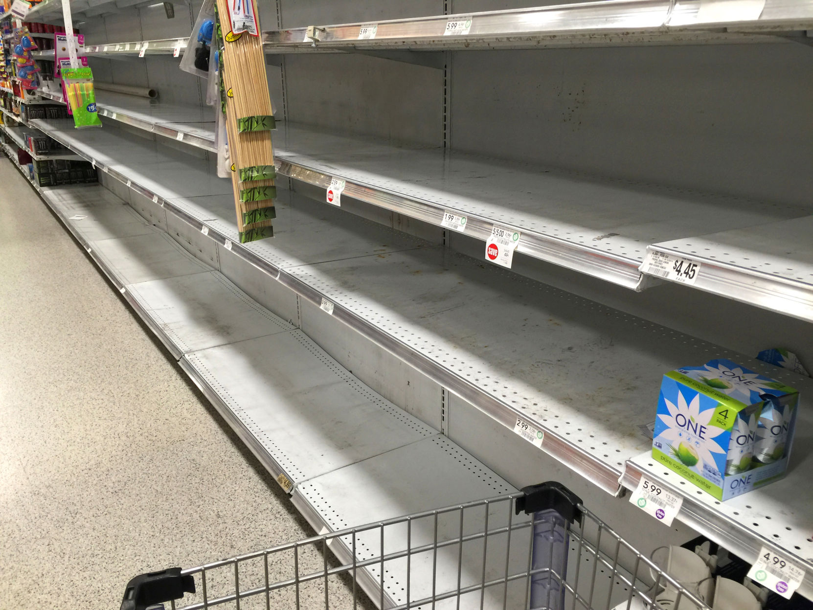 Empty grocery shelves bottled water storm